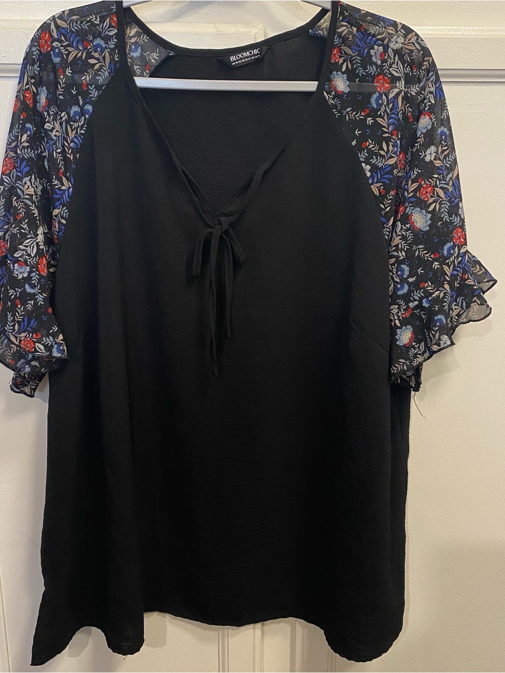 BloomChic Black Tie-Neck Blouse with Floral Sleeves